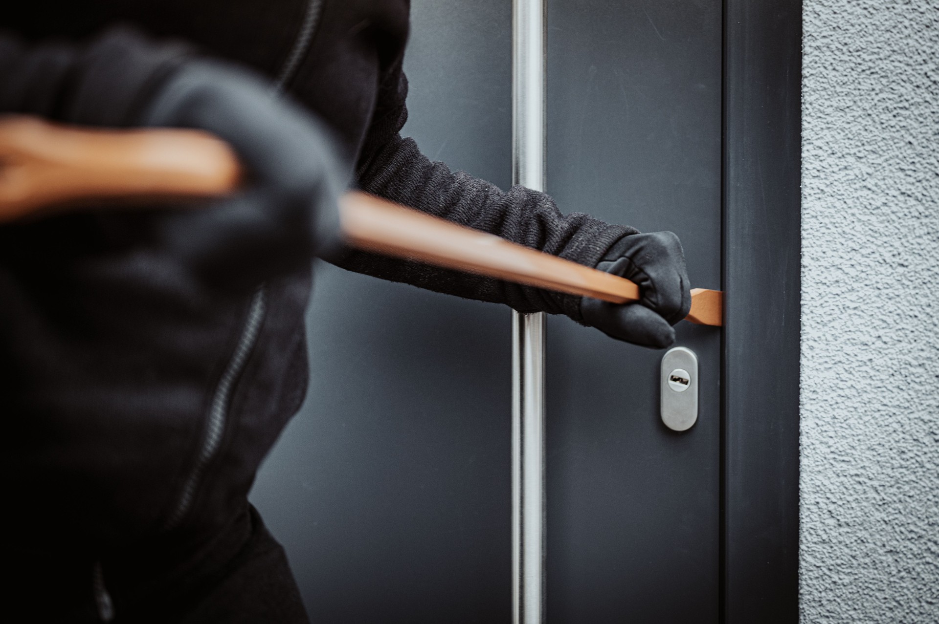 Burglar picking lock